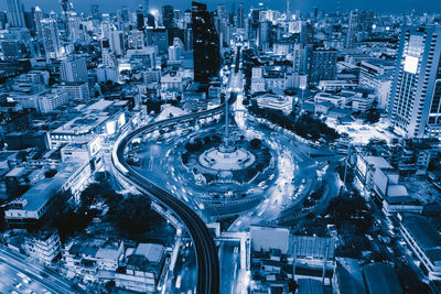 High angle view of street amidst buildings in city during winter
