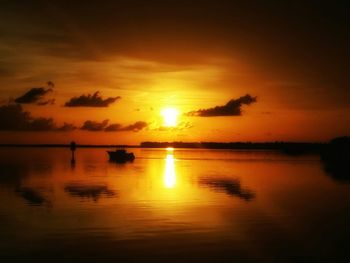 Scenic view of sunset over river