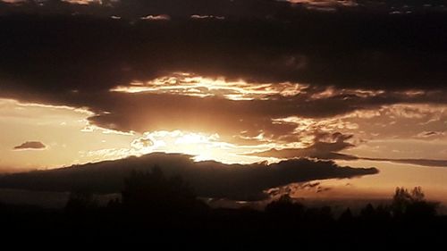 Scenic view of silhouette landscape against sky during sunset