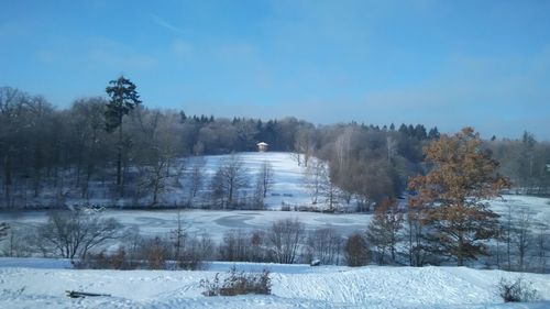 Scenic view of snow covered field