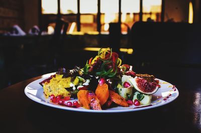 Close-up of fruits in plate on table