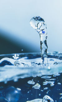 Close-up of water splashing against black background