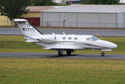 Side view of airplane on runway