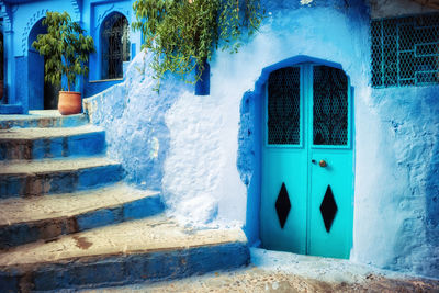 Closed blue door of building