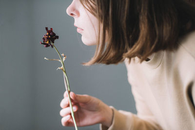 Close-up of girl holding flower