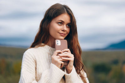 Young woman using mobile phone