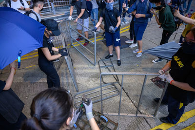 High angle view of people standing on street