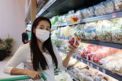 Portrait of woman shopping at supermarket