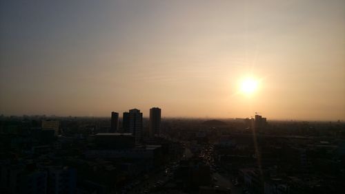 Cityscape against sky during sunset