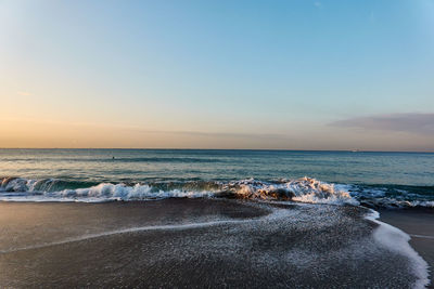 Scenic view of sea against sky during sunrise