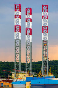 Low angle view of crane against blue sky