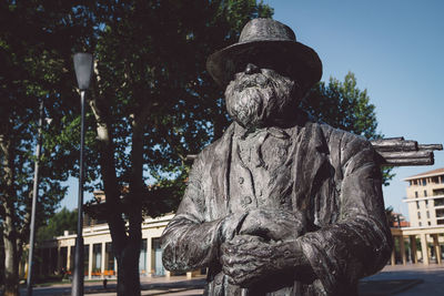 Low angle view of statue against sky