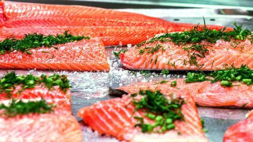 Pieces of raw salmon with dill