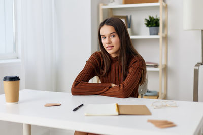 Portrait of businesswoman working at home