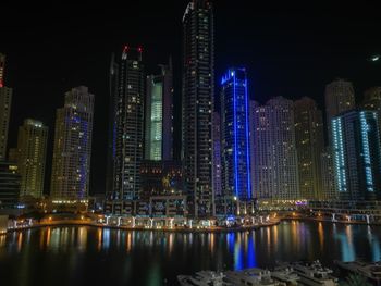 Low angle view of illuminated city at night