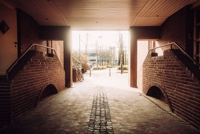 Empty alley amidst buildings