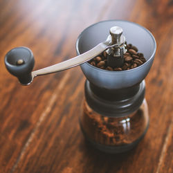 Close-up of coffee grinder on table