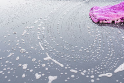 Full frame shot of wet glass window in rainy season