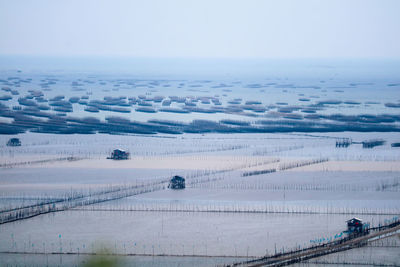 High angle view of snow covered landscape against sky