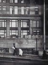 Rear view of man walking on city street