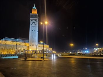 Illuminated building against sky at night