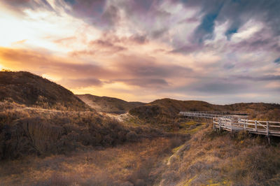 Scenic view of landscape against sky during sunset