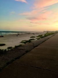 Scenic view of beach against sky during sunset