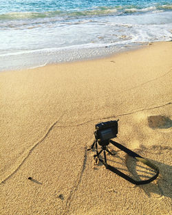 High angle view of sunglasses on beach