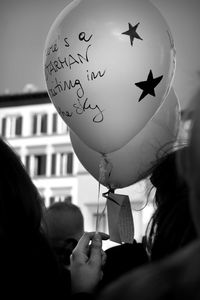 Close-up portrait of people holding painting