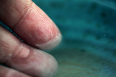 Close-up of hand holding water