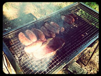 Close-up of meat on barbecue grill