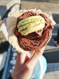 Close-up of hand holding ice cream