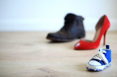 Close-up of shoes on hardwood floor