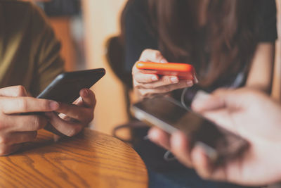 Midsection of woman using mobile phone