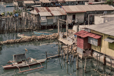 High angle view of canal amidst buildings in city