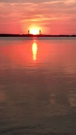 Scenic view of sea against orange sky