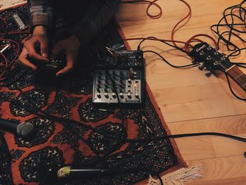 Low section of man working on floor