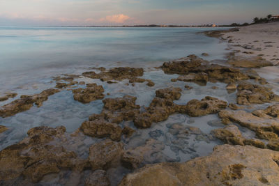 Scenic view of sea against sky at sunset