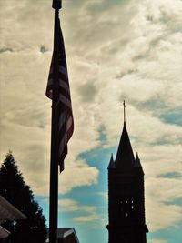 Low angle view of church against cloudy sky