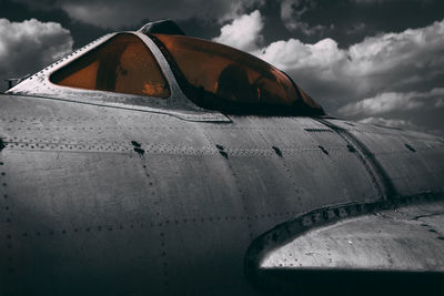 Abandoned airplane against sky