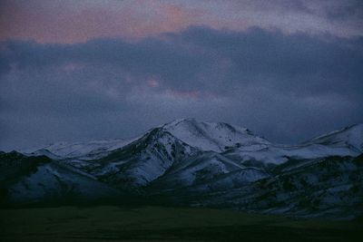 Scenic view of mountains against dramatic sky