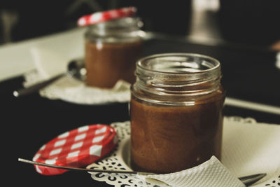 Close-up of food in jars on table