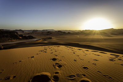 Scenic view of desert against clear sky