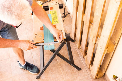 High angle view of man working on wood