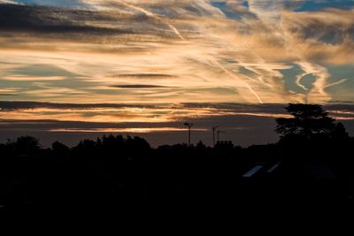 Scenic view of landscape against sky at sunset