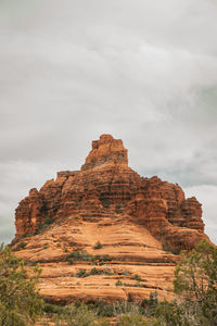 Bell rock at red rock coconino national forest in sedona arizona usa against white cloud background 