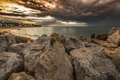 Scenic view of sea against sky at sunset