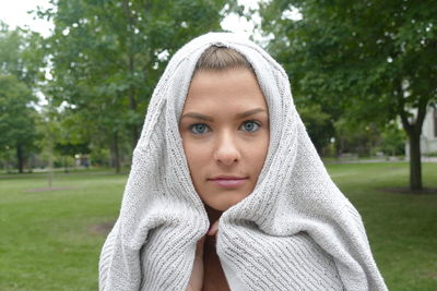 Close-up portrait of young woman in park