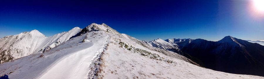 Scenic view of snow covered mountains