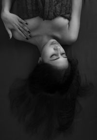 Midsection of woman lying down